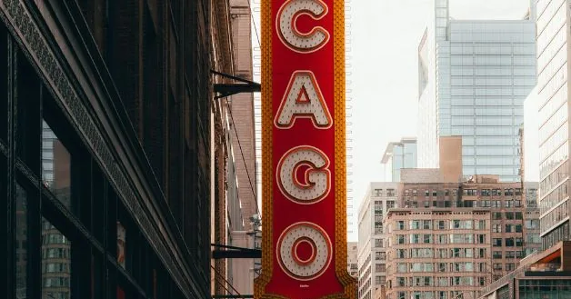 Chicago Theatre sign among downtown buildings
